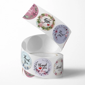 Floral Thank You sticker roll with colorful botanical patterns for gift packaging