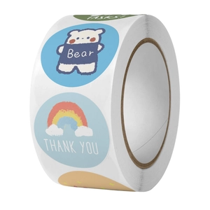 Close-up of cute cartoon stickers on a roll for DIY scrapbooking and gift sealing