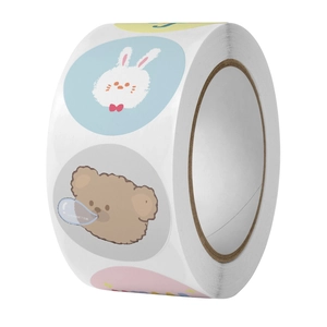 Macro view of cute bear and rabbit stickers roll for DIY scrapbooking and packaging
