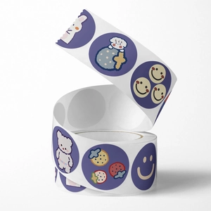 Roll of cartoon round animal stickers with cute bear and rabbit hand-drawn illustrations