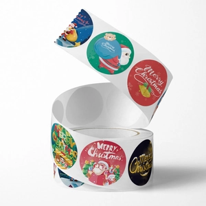 Christmas round roll stickers featuring Santa and reindeer designs for festive gift sealing