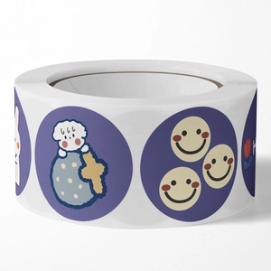 Roll of cartoon animal stickers with cute dogs and smiley faces for gift sealing