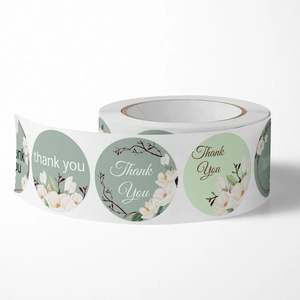 Roll of floral thank you stickers with white magnolia flowers for gift packaging