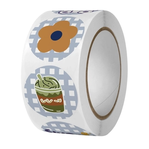Detailed macro view of a 2.5cm roll of cartoon floral and coffee decorative stickers