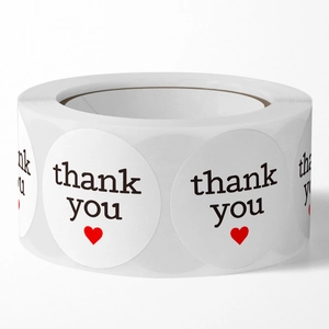 Roll of round white Thank You stickers with red heart for gift packaging and sealing