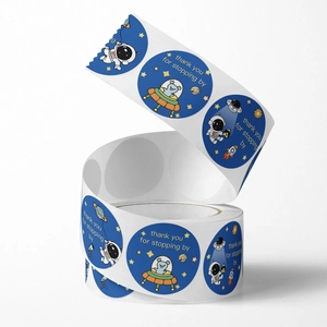Space-themed round thank you stickers roll featuring cute astronauts and planets
