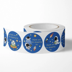 Space themed thank you stickers roll featuring astronauts and rockets for gift wrapping