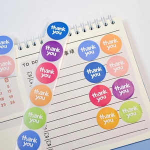 Set of colorful round Thank You stickers on a daily planner for DIY decoration