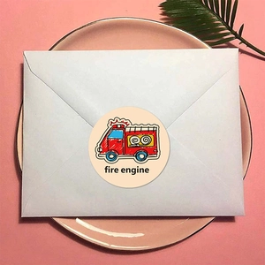 Cartoon fire engine round reward sticker on white envelope for kids and craft decor