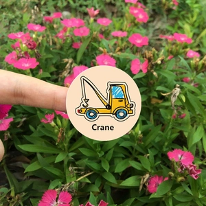 Round cartoon crane sticker for kids with Crane text, shown outdoors for size reference