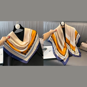Elegant geometric print silk-like square scarf 90cm featuring orange and gold patterns