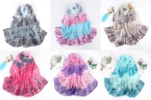 Detail of floral chiffon scarves in various gradient colors for beach and sun protection