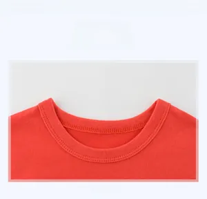 Close-up of red crew neck with ribbed collar and double-stitched seams for boys