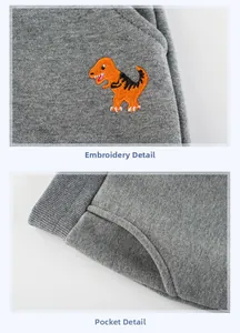 Détails du jogging gris enfant avec broderie dinosaure orange et poche latérale