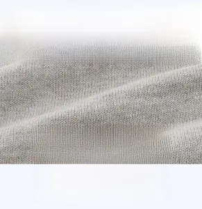 Macro view of grey knit cotton fabric showing soft texture and breathable fibers