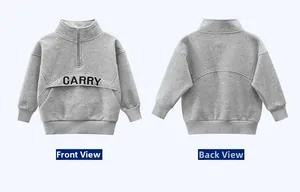 Flat lay of heather grey half-zip kids sweatshirt showing front and back with CARRY print
