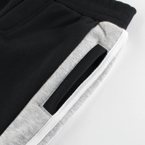 Pantalon de sport en polaire pour garçon noir avec panneaux gris et taille élastique