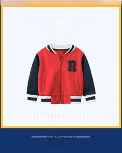 Detail view of kids red baseball jacket with navy sleeves and striped ribbed cuffs