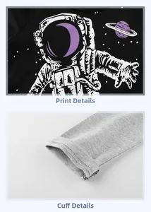 Macro detail of astronaut print and ribbed knit grey cuffs on a boys' long sleeve shirt