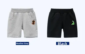 Detail of gray and black cotton kids shorts with cute cartoon dinosaur patches
