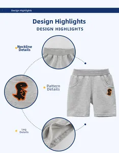 Detail view of boys gray cotton shorts featuring elastic waist and dinosaur embroidery