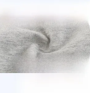 Macro shot of grey knit fabric texture showing soft, breathable, and comfortable material