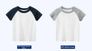 Flat lay of cotton crewneck raglan t-shirts in cream with navy and heather grey sleeves