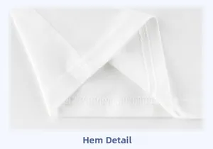 Detailed macro view of the double-needle flat-stitch hem on white cotton children shirt