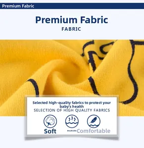 Gros plan détaillé du tissu en coton jaune doux pour t-shirt garçon avec imprimé cartoon