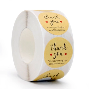 Roll of oval kraft paper thank you stickers with hearts for small business packaging