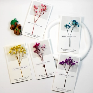 Handmade gift cards with dried flowers and greeting text for diverse occasions