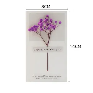 Detailed view of dried purple flowers on a white gift card with size 8x14cm marked