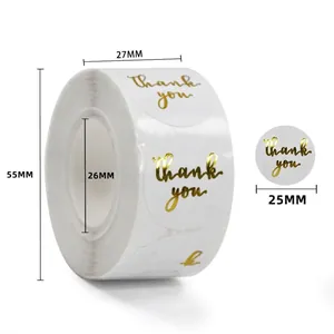 Macro detail of 25mm round gold foil Thank You stickers showing roll dimensions and specs