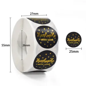 Detail of 25mm black handmade with love stickers roll with gold foil for gift wrapping