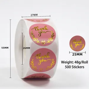 Detailed close-up of 25mm pink and gold foil thank you stickers with 500 pieces per roll