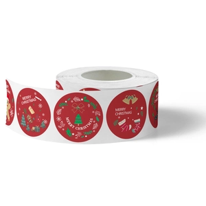 Roll of red Christmas stickers with Merry Christmas greeting and holiday graphics