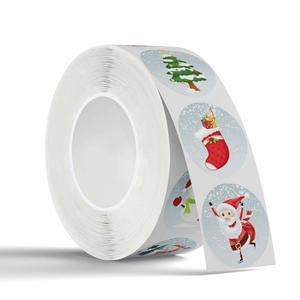 Roll of festive Christmas stickers with Santa, tree, and snowman icons on white background