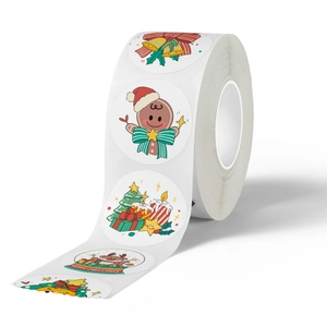 Roll of colorful hand-drawn Christmas stickers with cute holiday patterns for decoration