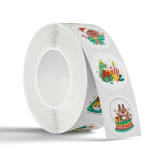 Roll of cartoon Christmas stickers with reindeer and gingerbread man motifs