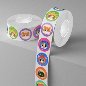 Roll of cute cartoon cat food labels featuring colorful toast and burger kitty designs