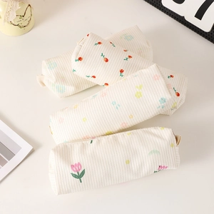 Detailed macro view of the thick canvas floral pencil case with soft stripe texture