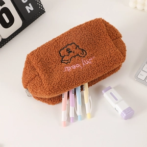 Detailed view of brown plush bear pencil case with soft texture and sturdy metal zipper