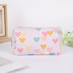 Macro view of purple quilted heart pencil case with premium metal zipper detail