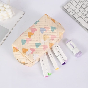 Detailed close-up of cream heart pencil case with large capacity and wavy pattern