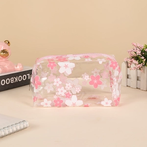 Close-up of a large capacity transparent pencil case with pink cherry blossom prints