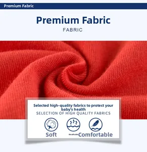 Close-up of soft red cotton knit fabric detail showing breathable texture and premium quality