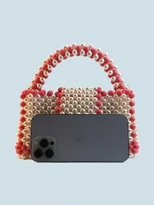 Mini sac à main tissé à la main en perles blanches et rose corail pour femmes