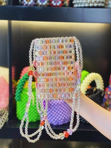 Macro detail of colorful candy-colored acrylic handmade beaded crossbody phone bag
