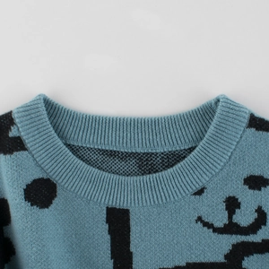 Blue knit sweater for boys featuring creative abstract prints and a ribbed crew neckline