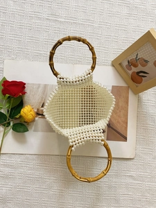 Handmade pearl beaded handbag with vintage bamboo handle for elegant evening parties